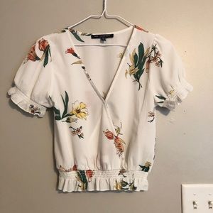 A cute blouse made by One Clothing.